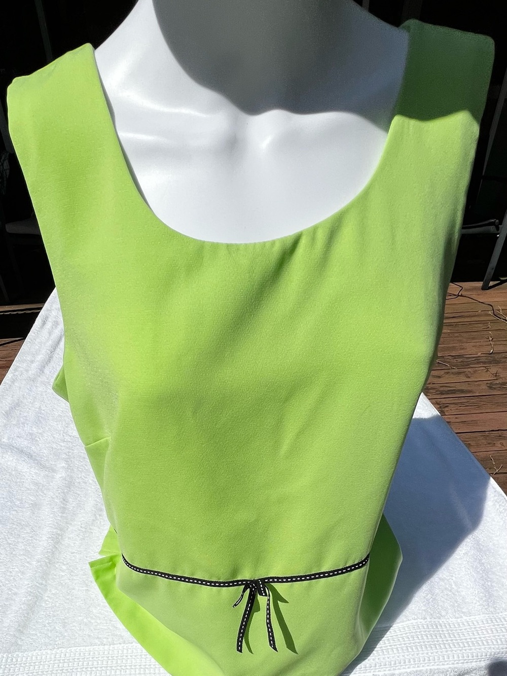 Lime green vintage 90s blouse with black bow detail. Size: 14.